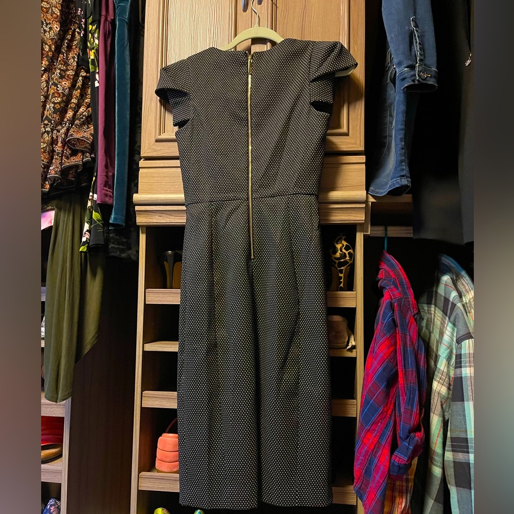 Calvin Klein office dress. Very flattering and elegant.Never used it